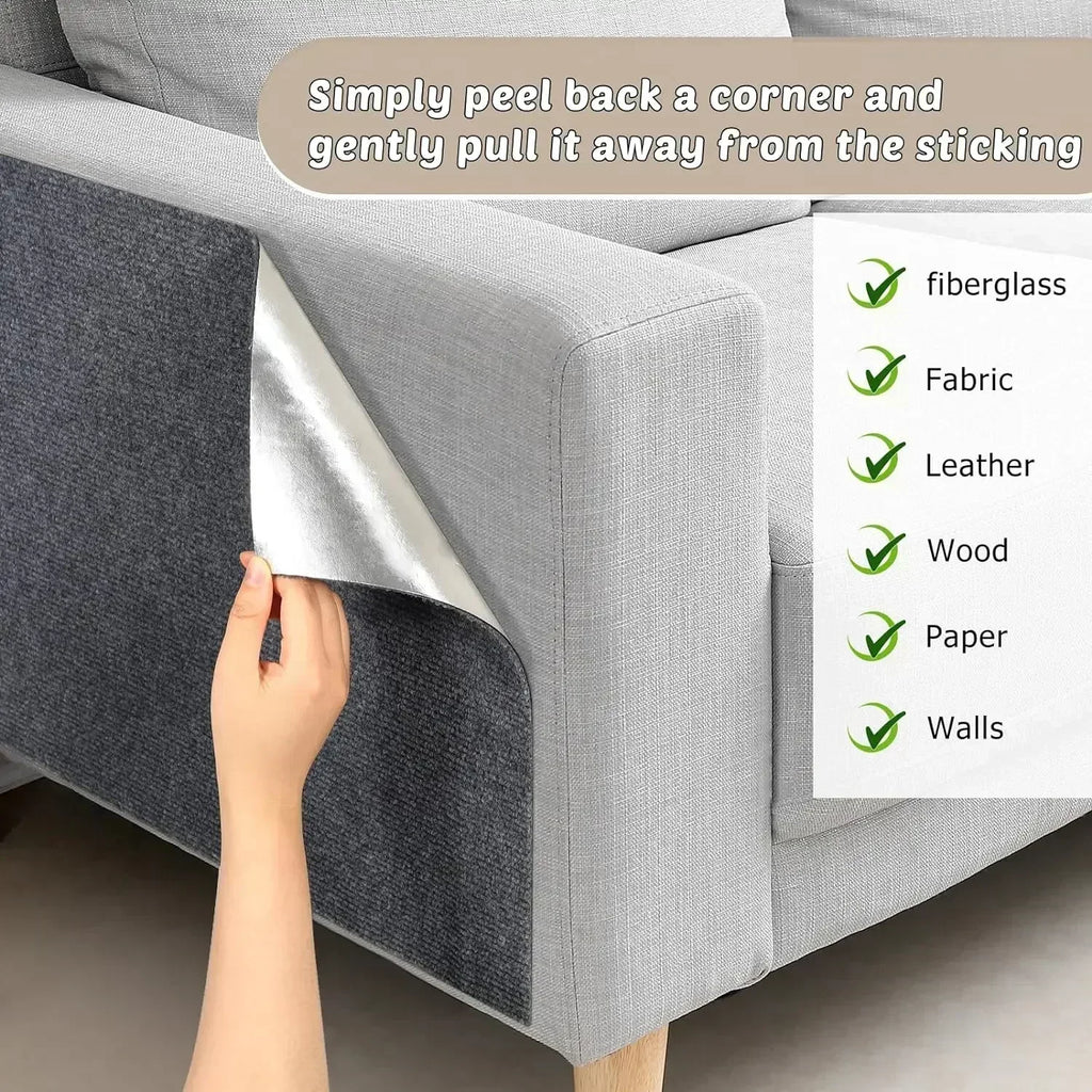 Dark grey self-adhesive scratching mat being applied to a sofa
